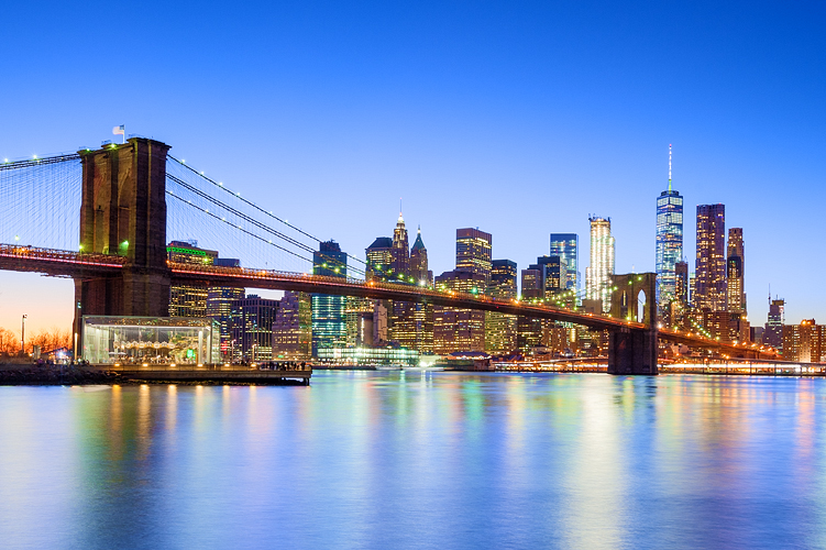 Downtown skyline and Brooklyn Bridge, New York, illuminated at night