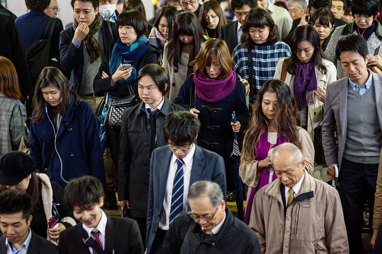 Crowd of commuters in Shinjuku Station, Tokyo